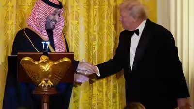 President Donald Trump and Saudi Arabia's Crown Prince Mohammed bin Salman shake hands during a dinner in the East Room of the White House Trump designates Riyadh as major non-Nato ally in renewed US-Saudi clinch
